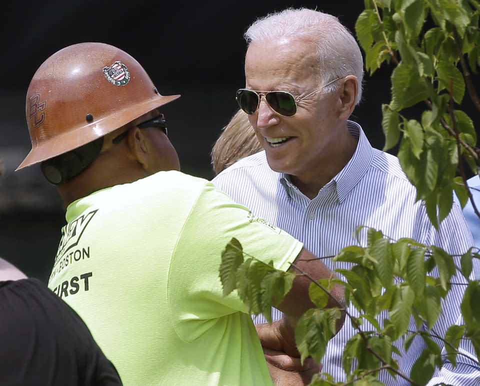 Joe Biden chats with a construction worker during a visit to Boston on June 5.  