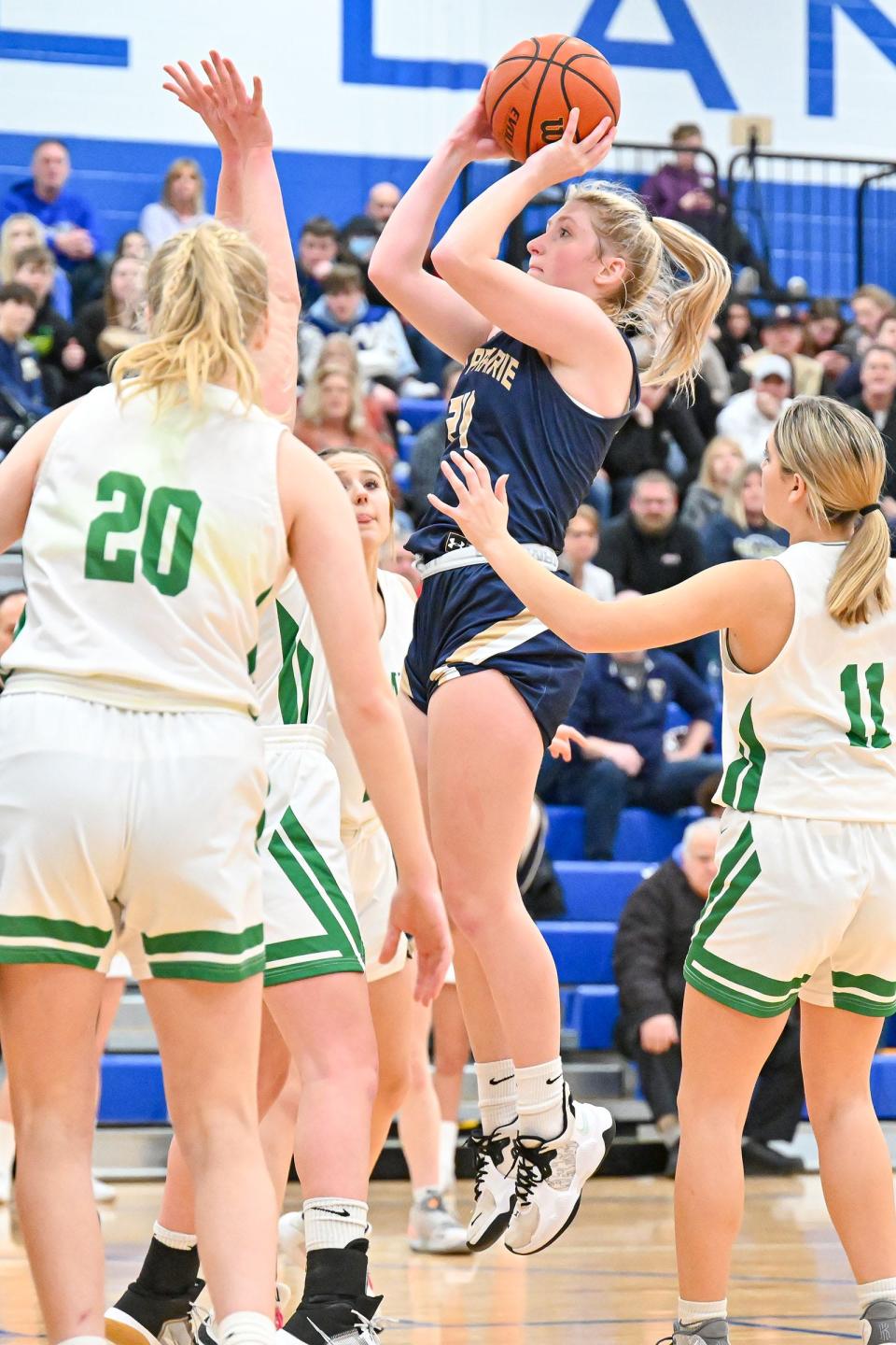 New Prairie’s Maddie McSurley (24) shoots in the fourth quarter of the TCU Bi-County Girls Varsity Finals Saturday, Jan. 22, 2022, at LaVille High School.