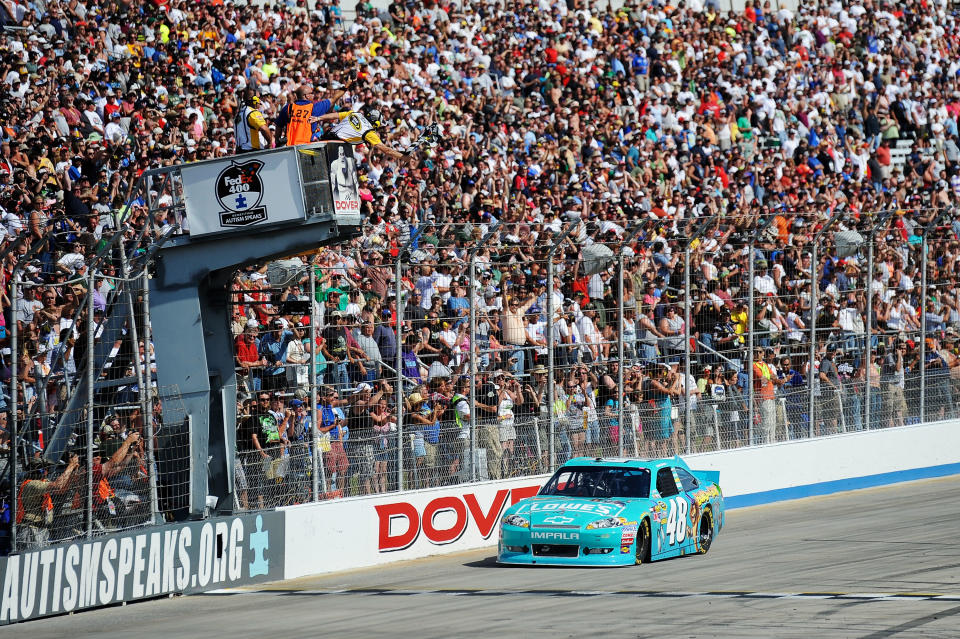 DOVER, DE - JUNE 03: Jimmie Johnson, driver of the #48 Lowe's Madagascar Chevrolet, races to the checkered flag to win the NASCAR Sprint Cup Series FedEx 400 benefiting Autism Speaks at Dover International Speedway on June 3, 2012 in Dover, Delaware. (Photo by Patrick McDermott/Getty Images for NASCAR)