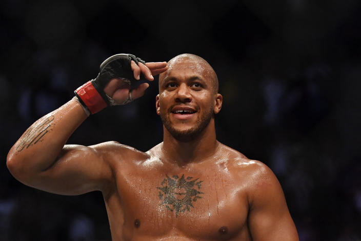 French fighter Ciryl Gane celebrates after defeating Australian fighter Tai Tuivasa in their men&#39;s heavyweight fight during the Ultimate Fighting Championship (UFC) event at the Accor Arena in Paris, on September 3, 2022. (Photo by JULIEN DE ROSA / AFP) (Photo by JULIEN DE ROSA/AFP via Getty Images)