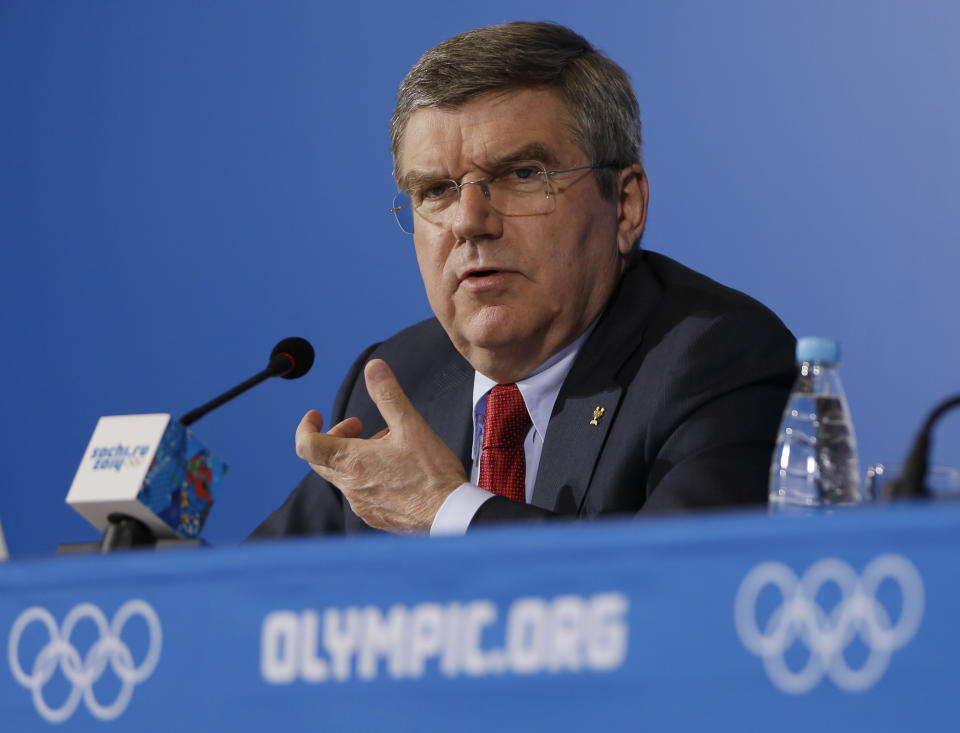 International Olympic Committee President Thomas Bach answers a question during a news conference at the 2014 Winter Olympics, Sunday, Feb. 23, 2014, in Sochi, Russia. (AP Photo/Morry Gash)