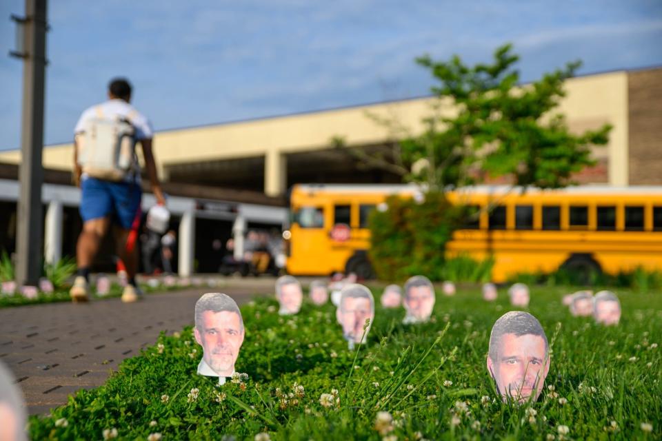 On the Central High School seniors’ last day on May 12, staff and students printed out photos of retiring Athletic Director J.D. Lambert’s face and staked out the lawn ahead of a pep rally in his honor.