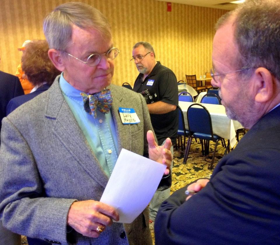 Larry Majors, left, talks with former Tennessean sports editor Larry Taft at a roast for Majors' brother Johnny in Fayetteville, Tenn.