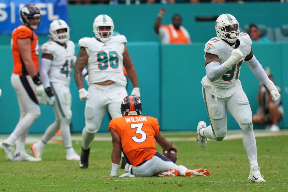 <a class="link " href="https://sports.yahoo.com/nfl/teams/miami/" data-i13n="sec:content-canvas;subsec:anchor_text;elm:context_link" data-ylk="slk:Miami Dolphins;sec:content-canvas;subsec:anchor_text;elm:context_link;itc:0">Miami Dolphins</a> defensive end <a class="link " href="https://sports.yahoo.com/nfl/players/29266" data-i13n="sec:content-canvas;subsec:anchor_text;elm:context_link" data-ylk="slk:Emmanuel Ogbah;sec:content-canvas;subsec:anchor_text;elm:context_link;itc:0">Emmanuel Ogbah</a> (91) celebrates a sack Denver Broncos quarterback <a class="link " href="https://sports.yahoo.com/nfl/players/25785" data-i13n="sec:content-canvas;subsec:anchor_text;elm:context_link" data-ylk="slk:Russell Wilson;sec:content-canvas;subsec:anchor_text;elm:context_link;itc:0">Russell Wilson</a> (3) during the fourth quarter of an NFL game at Hard Rock Stadium in Miami Gardens, Sept. 24, 2023.