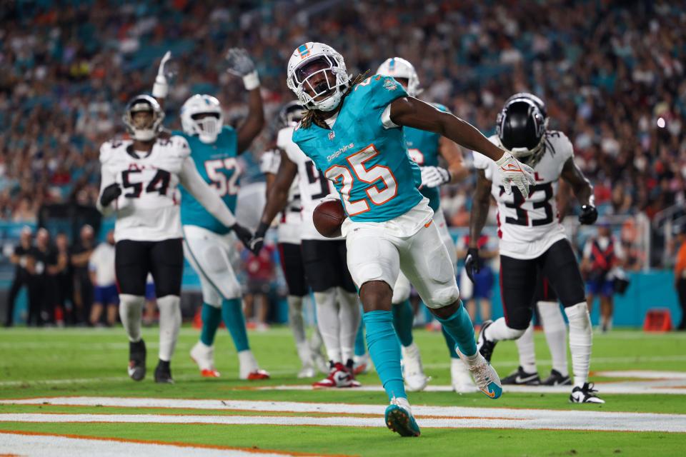 Aug 9, 2024; Miami Gardens, Florida, USA; Miami Dolphins running back Jaylen Wright (25) celebrates after scoring a touchdown against the Atlanta Falcons in the second quarter during preseason at Hard Rock Stadium. Mandatory Credit: Nathan Ray Seebeck-USA TODAY Sports