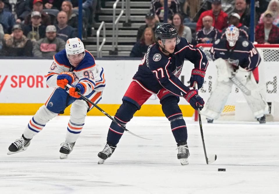 Feb. 25, 2023; Columbus, Ohio, USA; Columbus Blue Jackets defenseman Nick Blankenburg (77) is defended by Edmonton Oilers center Ryan Nugent-Hopkins (93) at Nationwide Arena in this file photo. Mandatory Credit: Barbara J. Perenic/Columbus Dispatch
(Credit: Barbara J. Perenic/Columbus Dispatch)