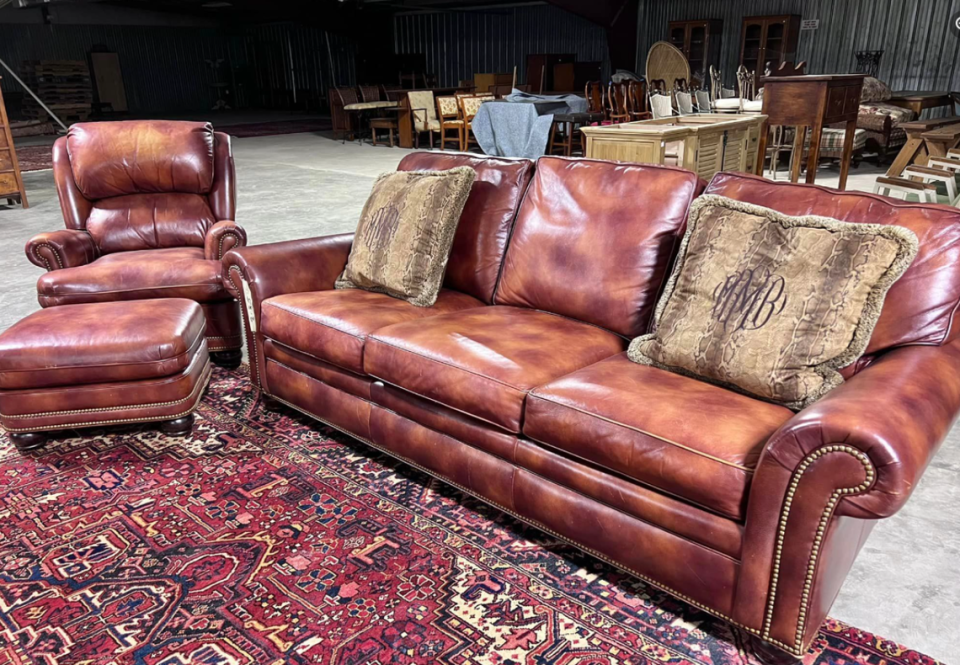 Among the items shown that will be at the Liberty Auction sale include a leather living room set and pillows with Maggie Murdaugh’s initials embroidered on them.