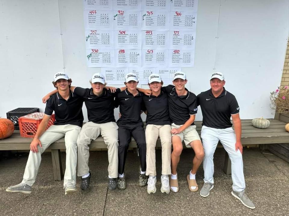 Hiland's golf team is all smiles after shooting a 313 to win a sectional title.