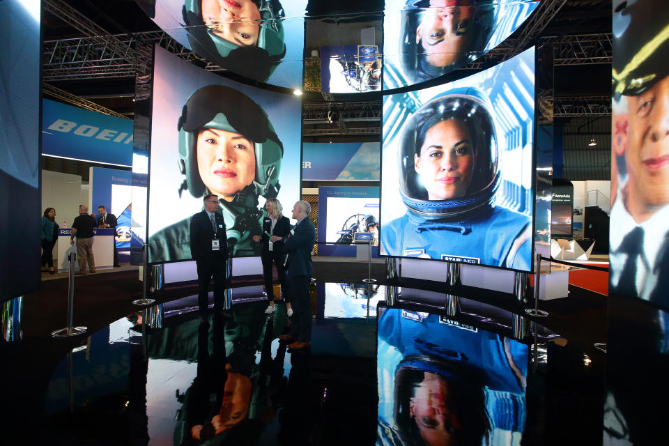 SINGAPORE - FEBRUARY 11:  Visiotrs stand inside a video display at Boeing booth during the Singapore Airshow 2020 at the Changi Exhibition Centre on February 11, 2020 in Singapore. The Singapore Airshow is Asia's largest Aerospace and Defence event.  (Photo by Suhaimi Abdullah/Getty Images)