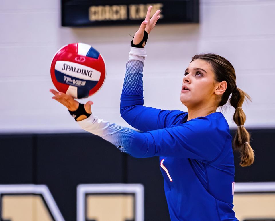 Westlake Chaparrals libero Reese Emerick (1) serves the ball against the Johnson Jaguars  during the second set at the District 26-6A volleyball game on Tuesday, October 4, 2022, at Johnson High School in Buda, TX.