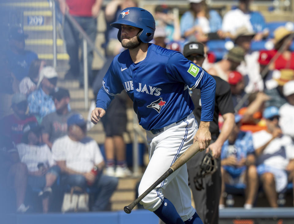 Toronto Blue Jays pitcher Tim Mayza plays bat boy during a spring training baseball game against the Philadelphia Phillies in Dunedin, Fla., Saturday, Feb. 24, 2024. (Frank Gunn/The Canadian Press via AP)