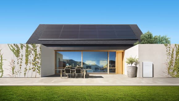 A house equipped with Tesla solar panels and a Powerwall
