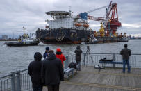Tugs pull the Russian pipe-laying vessel "Fortuna" out of the harbour and into the Baltic Sea at the port of Wismar, Germany, Thursday, Jan 14, 2021. The special vessel is being used for construction work on the German-Russian Nord Stream 2 gas pipeline in the Baltic Sea. ( Jens Buettner/dpa via AP)