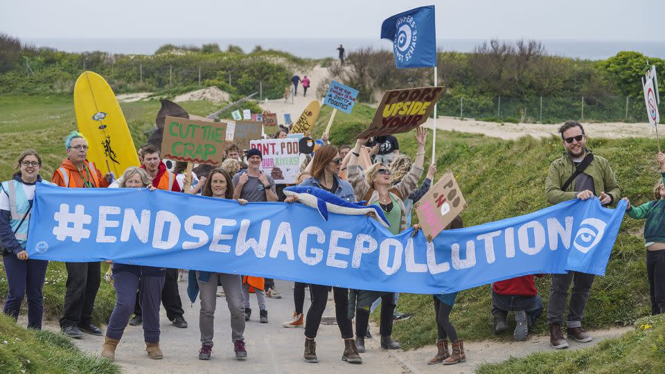 Campaigners take part in a Surfers Against Sewage demonstration in Newquay, England, in April 2022. - Hugh R Hastings/Getty Images