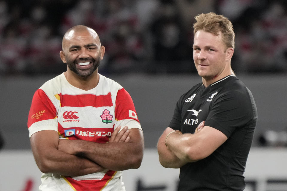 New Zealand's captain Sam Cane, right, and Japan's captain Michael Leitch talk after a rugby test match between the All Blacks and Japan at the National Stadium in Tokyo, Japan, Saturday, Oct. 29, 2022. (AP Photo/Shuji Kajiyama)