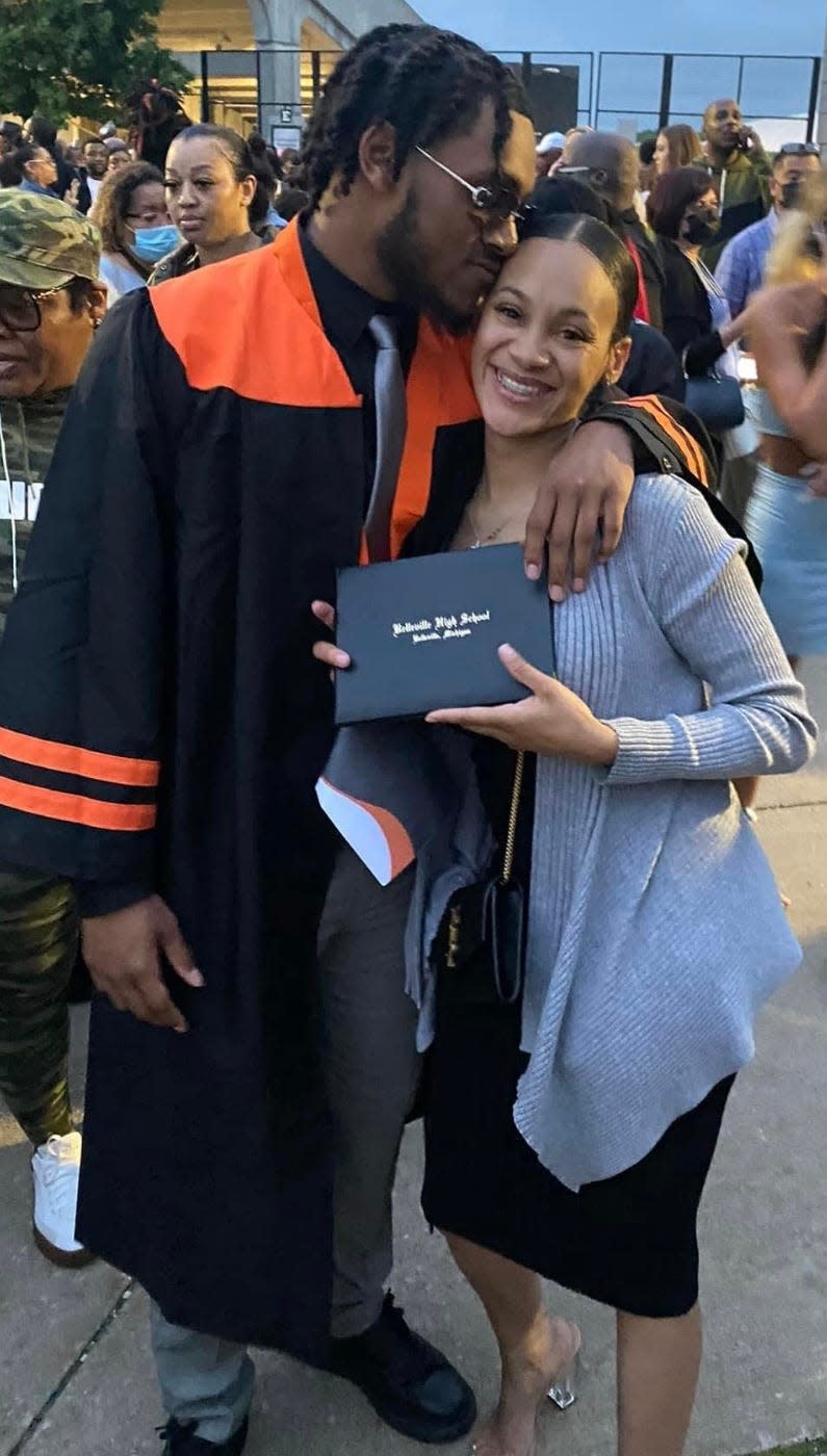 Deshaun Lee and his mother, Passion Lewis, at his high school graduation.