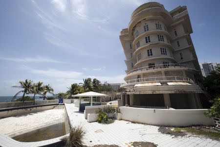 A view of the empty swimming pool and the outside of the luxury Normandie Hotel, closed since 2008, in San Juan, Puerto Rico, July 18, 2015. REUTERS/Alvin Baez