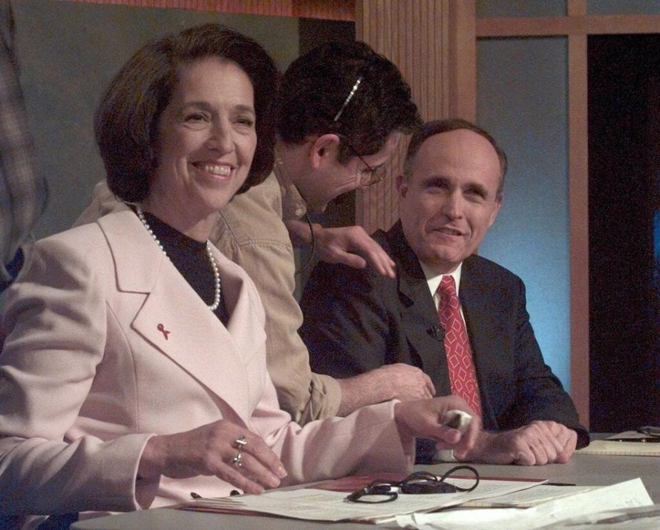 New York Democratic mayoral candidate Ruth Messinger, left, and her Republican opponent, incumbent Rudy Giuliani, right, prepare for a televised debate at WABC studios in New York Wednesday, Oct. 29, 1997.