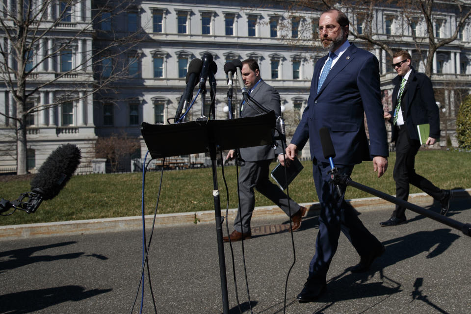 Health and Human Services Secretary Alex Azar walks to speak to media outside the West Wing of the White House in Washington, Monday, March, 9, 2020. (AP Photo/Carolyn Kaster)