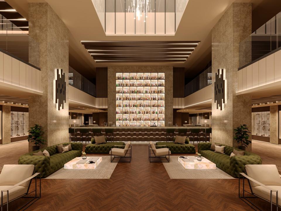 A rendering of a two-floor lobby with lounge chairs in the Explora I.