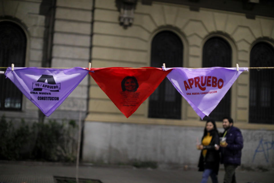 Handkerchiefs with the word "Approve" showing support for the proposed new Constitution hang over a street in Santiago, Chile, Thursday, Sept. 1, 2022. Chileans have until the Sept. 4 plebiscite to study the new draft and decide if it will replace the current Magna Carta imposed by a military dictatorship 41 years ago. (AP Photo/Cristobal Escobar)