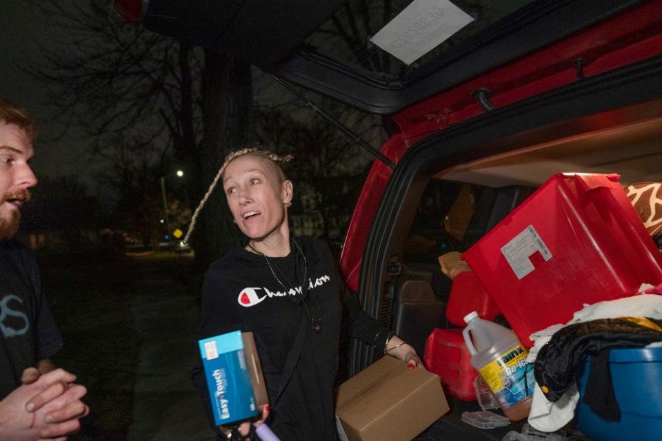 Amanda arrives at her friend Red’s Detroit home with harm reduction supplies on the evening of Monday, Dec. 5, 2022. The two had earlier gone to ACCESS to pick up the supplies to break down for distribution.