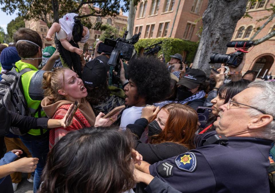 Officers and demonstrators clash