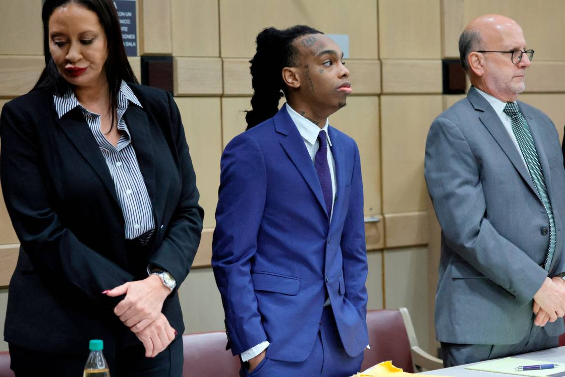 Jamell Demons, better known as rapper YNW Melly, stands with his attorneys,Raven Ramona Liberty, left, and Stuart Adelstein, as jurors enter the courtroom for closing arguments in his trial at the Broward County Courthouse in Fort Lauderdale on Thursday, July 20, 2023. Demons, 22, is accused of killing two fellow rappers and conspiring to make it look like a drive-by shooting in October 2018. (Amy Beth Bennett / South Florida Sun Sentinel) Amy Beth Bennett/South Florida Sun Sentinel