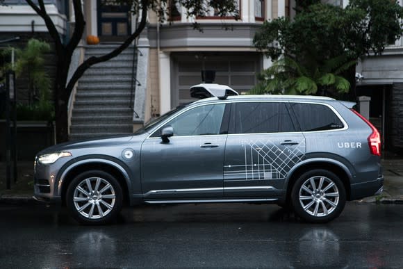 Uber's autonomous Volvo sitting on a road.