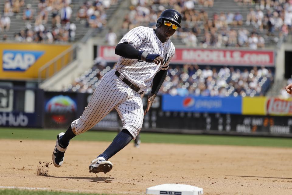 New York Yankees' Didi Gregorius runs past third base to score on a single by Gleyber Torres during the fourth inning of a baseball game against the Colorado Rockies Saturday, July 20, 2019, in New York. (AP Photo/Frank Franklin II)