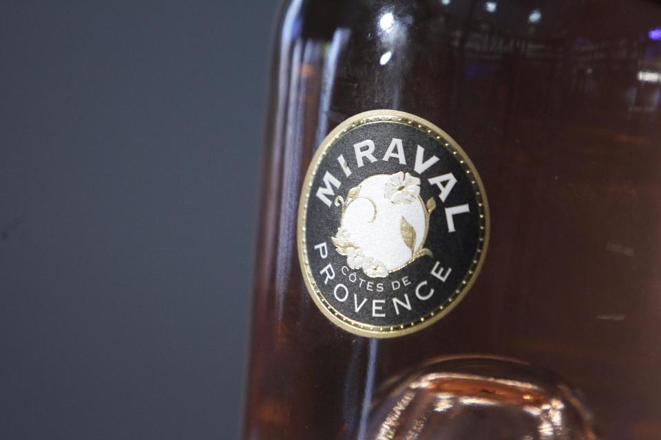 CAPTION CORRECTS NAME OF BOTTLE FROM MIRAMAR TO MIRAVAL A bottle of Miraval 2013 is pictured in Paris, Friday, Jan. 31, 2014. The latest Brad Pitt-Angelina Jolie sequel is being described as powerful and elegant with a “mouthwatering finish.” These raves don’t appear in Hollywood bible Variety _ they’re from Decanter magazine’s review of the celebrity couple’s second vintage of rose wine produced at their Provencal estate Chateau Miraval. The 2013 Miraval goes on sale online Friday and will be in shops and restaurants around the world next month. (AP PhotoThibault Camus)