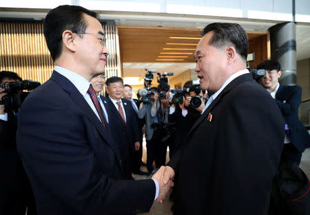 South Korean Unification Minister Cho Myoung-gyon greets his North Korean counterpart Ri Son Gwon before their meeting at the truce village of Panmunjom, South Korea, June 1, 2018. Yonhap via REUTERS