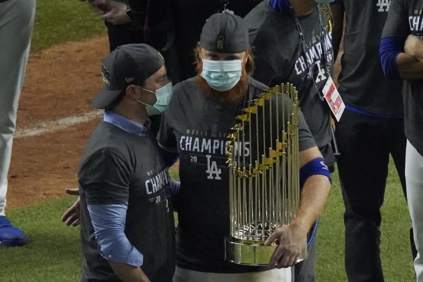 Los Angeles Dodgers third baseman Justin Turner celebrates with the trophy after defeating the Tampa Bay.