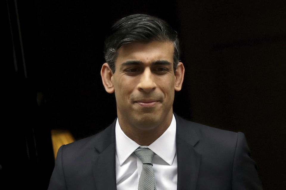 British Chancellor of the Exchequer Rishi Sunak leaves number 11 Downing Street, to deliver a financial announcement to the Houses of Parliament in London, Wednesday, July 8, 2020. British Treasury chief Rishi Sunak on Wednesday is set to announce a 2-billion-pound ($2.5 billion) program to create jobs for young people as the government tries to revive an economy battered by the COVID-19 pandemic. (AP Photo/Matt Dunham)