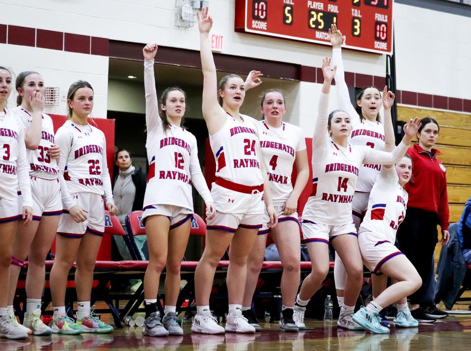 The Bridgewater-Raynham bench celebrates during a game against Dartmouth on Monday, Feb. 13, 2023.