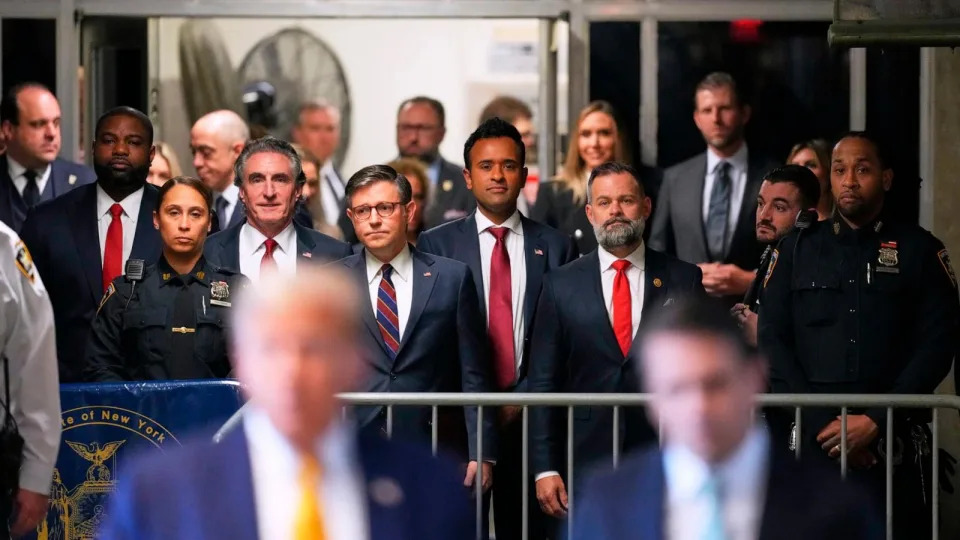 PHOTO: Doug Burgum, Speaker of the House Mike Johnson and Vivek Ramaswamy  look on as former President Donald Trump talks to the media outside Manhattan criminal court in New York, May 14, 2024.  (Curtis Means/AP)