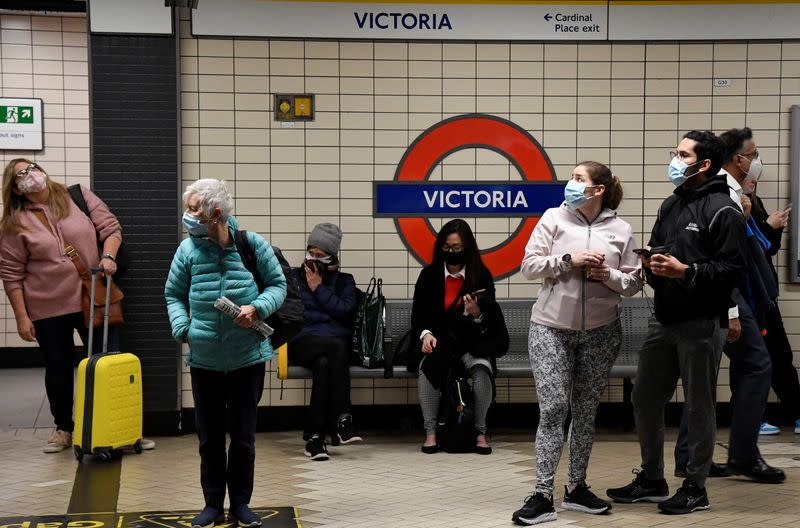 London Underground passengers wear masks, amidst the spread of the coronavirus disease (COVID-19) pandemic, in London