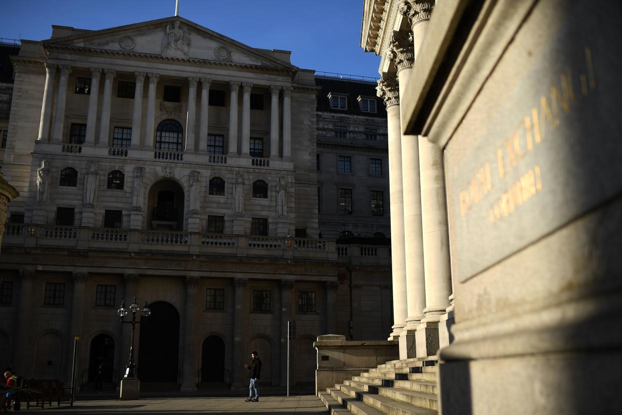 A man stands in the evening sun outside the Bank of England in central London on March 24, 2020, after Britain's government ordered a lockdown to slow the spread of the novel coronavirus. - Britain was under lockdown March 24, its population joining around 1.7 billion people around the globe ordered to stay indoors to curb the "accelerating" spread of the coronavirus. (Photo by DANIEL LEAL-OLIVAS / AFP) (Photo by DANIEL LEAL-OLIVAS/AFP via Getty Images)