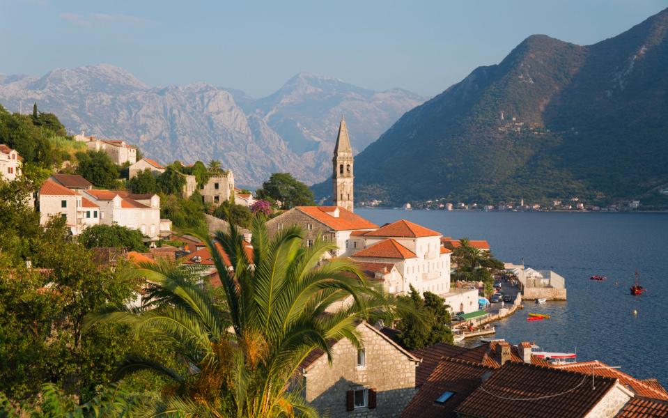 Kotor sits between mountains and a romantic sweep of the bay - DAVID C TOMLINSON