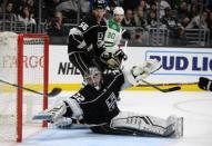 February 28, 2019; Los Angeles, CA, USA; Los Angeles Kings goaltender Jonathan Quick (32) blocks a shot against the Dallas Stars during the third period at Staples Center. Mandatory Credit: Gary A. Vasquez-USA TODAY Sports