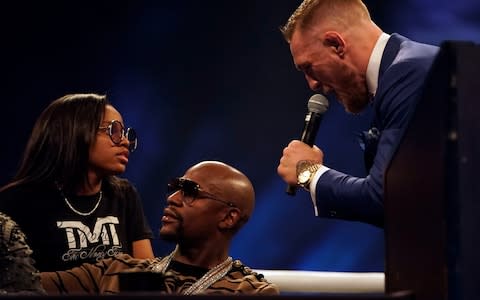 Conor McGregor taunts Floyd Mayweather Jr. during the Floyd Mayweather Jr. v Conor McGregor World Press Tour event at SSE Arena on July 14, 2017 in London, England - Credit: Jeff Bottari/Zuffa LLC/Zuffa LLC via Getty Images