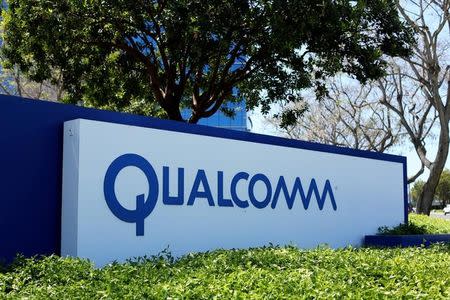 FILE PHOTO: A Qualcomm sign is pictured at one of its many campus buildings in San Diego, California, U.S. April 18, 2017. REUTERS/Mike Blake/File Photo