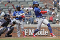 Toronto Blue Jays' Bo Bichette swings for a two run double in the ninth inning of a baseball game against the Atlanta Braves Thursday, May 13, 2021, in Atlanta. (AP Photo/Ben Margot)