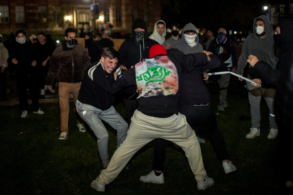 Demonstrators clash at an encampment at the University of California, Los Angeles, earlier in May (AP)