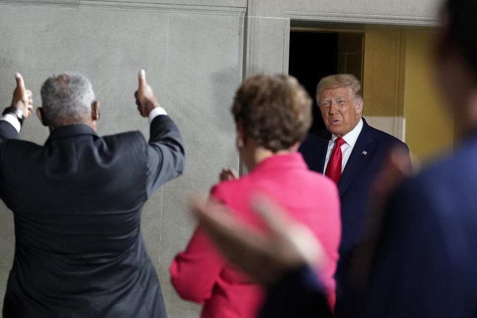 President Donald Trump smiles as he arrives to speak to the White House conference on American History at the National Archives museum, Thursday, Sept. 17, 2020, in Washington. (AP Photo/Alex Brandon)