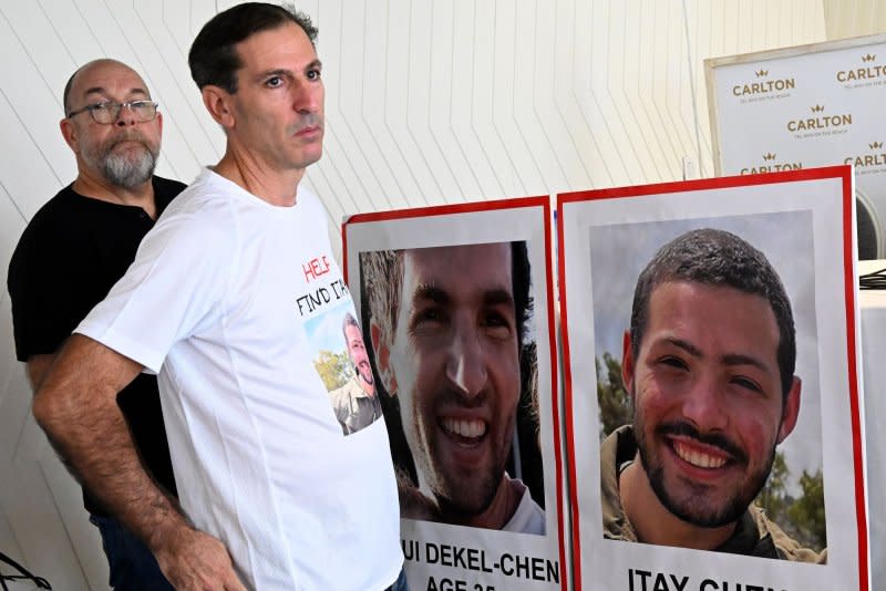 American-Israeli fathers (L-R) Jonathan Dekel-Chen and Rubi Chen, whose sons, Sagui Dekel-Chen, 35, and Itay Chen, 19, were taken hostage by Hamas on the Gaza border wait for a press conference Tuesday in Tel Aviv, Israel. Rubi Chen said the U.S. "has the power to do more" to rescue the hostages. Photo by Debbie Hill/UPI