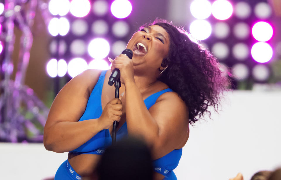 Lizzo performing onstage