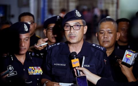 State police chief Mohamad Mat Yusop speaks to media outside the hospital morgue where Nora's body was taken - Credit: Lai Seng Sin/AP