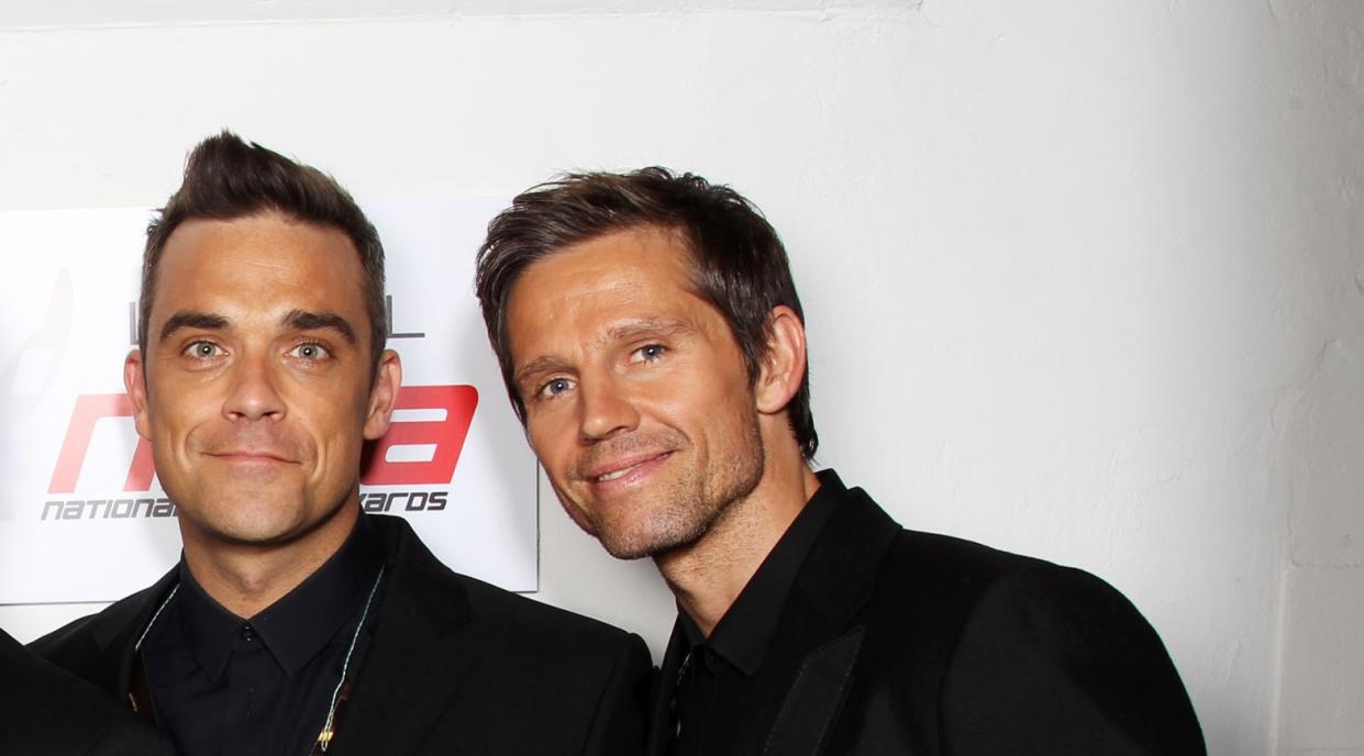 Take That's Robbie Williams and Jason Orange in 2011 (Credit: Getty Images)