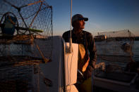 <p>Mayor and waterman James Eskridge sets out to check his crab traps during the early morning in Tangier, Virginia, May 16, 2017, where climate change and rising sea levels threaten the inhabitants of the slowly sinking island.<br> (Jim Watson/AFP/Getty Images) </p>